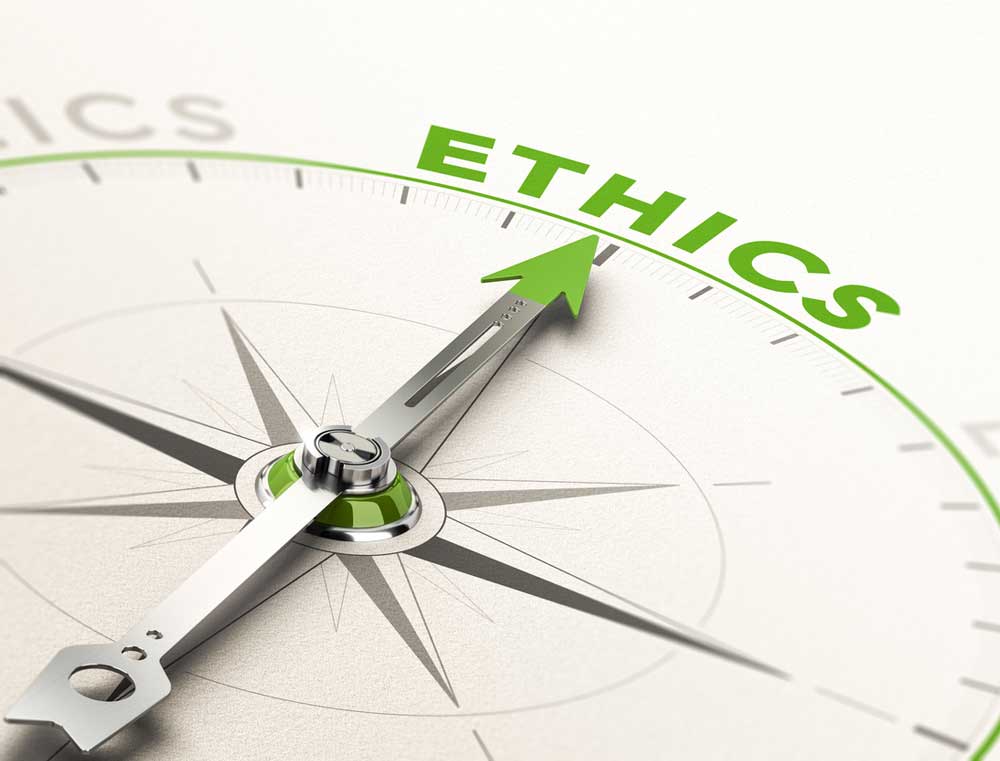 Compass needle pointing to the word ethics