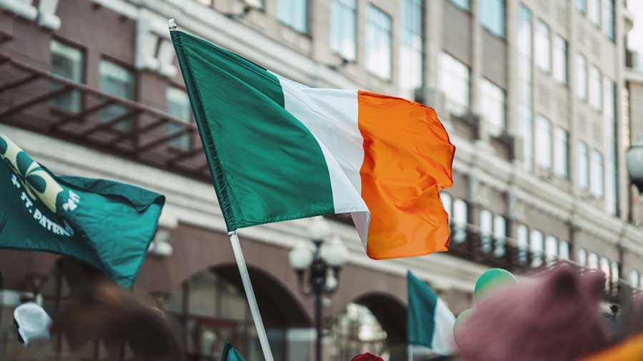The Irish flag being waved in the street