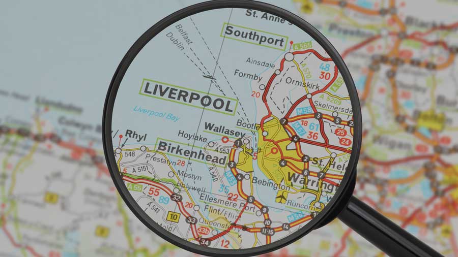 A magnifying glass over a map of Liverpool