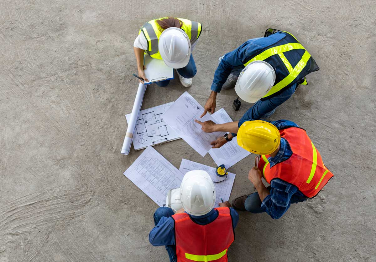 Building professionals discussing construction plans