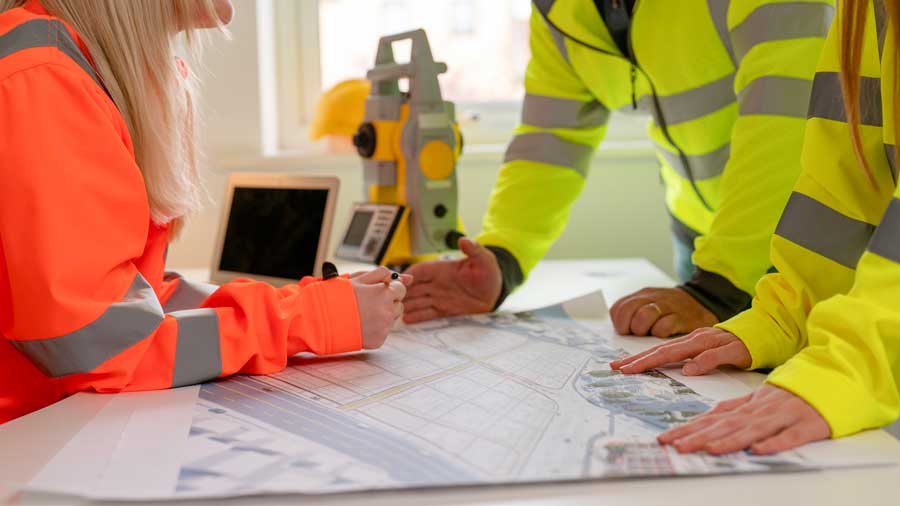 Building professionals collaborate on construction plans 
