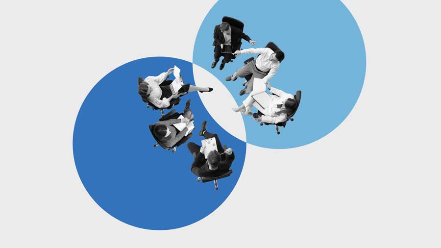 Employees sitting in overlapping circles as a symbol of integration 