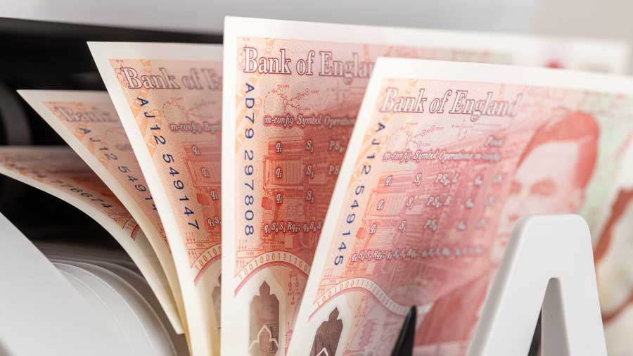 Bank of England notes in a money counting machine