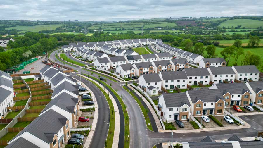 New housing estate surrounded by green fields